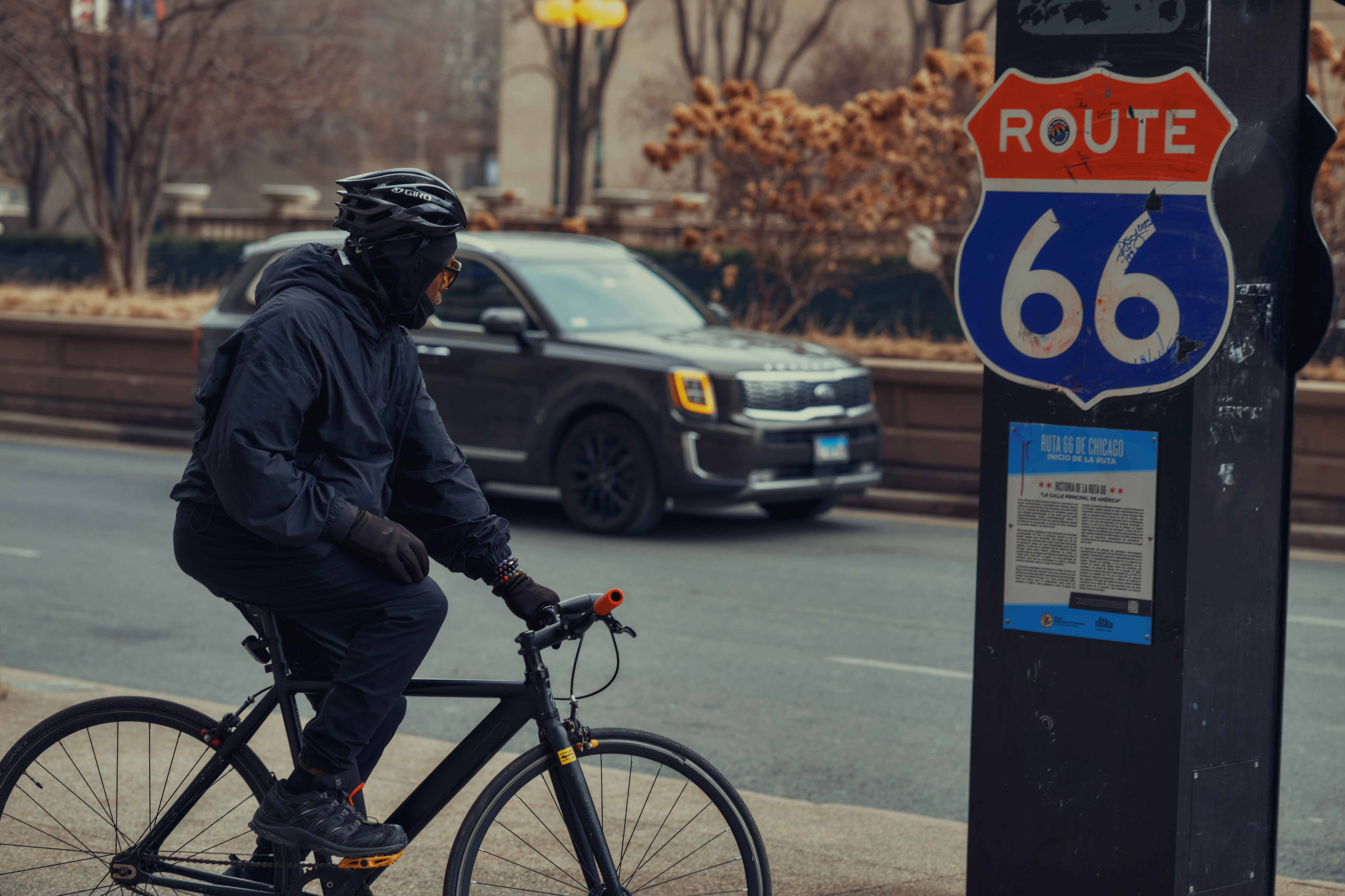 Cyclist at Route 66 sign in Chicago